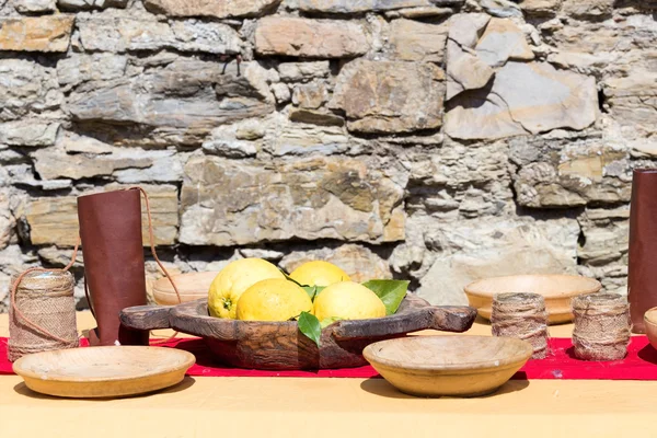 Lemons in medieval table — Stock Fotó