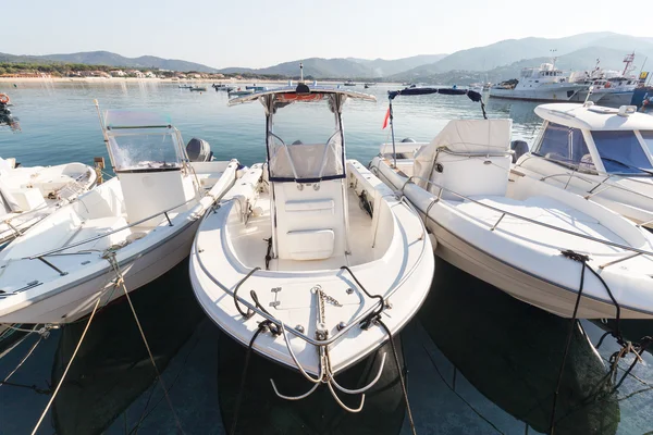 white boats in harbor