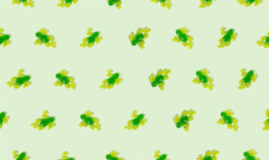 Parlak yeşil bir arka planda jelibon kurbağa şekerlemeleriyle yaratılmış yaratıcı desen. Asgari doğa konsepti. Güneşli gün gölgeleri.