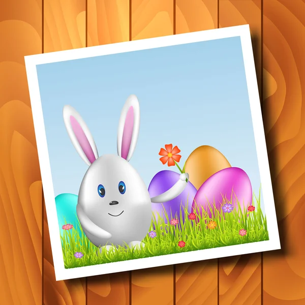 Пасхальный кролик и разноцветные яйца на весеннем медоу — стоковый вектор