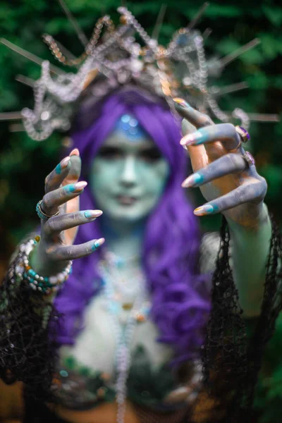 Fabulous dark mermaid with blue skin in the forest close up — Stock Photo, Image