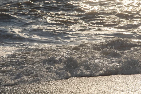 White sea foam near the shore close-up, waves — Stock Photo, Image