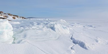 Ice and hummocks on the bank of the winter  Barents sea.  panora clipart