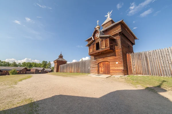 Wooden, timbered church the street in village. 