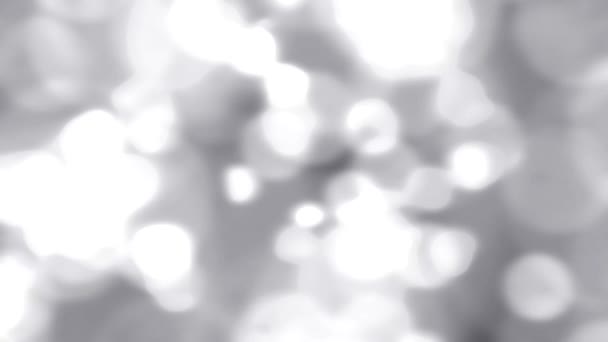 Luz chispeante chispas cámara lenta fondo abstracto desenfocado blanco plata — Vídeo de stock