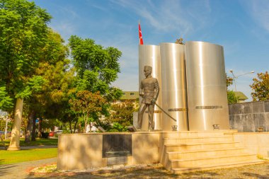 KEMER, TURKEY: Antalya 'nın Kemer ilçesinde güneşli bir günde parkta Mustafa Ertugrul anıtı.