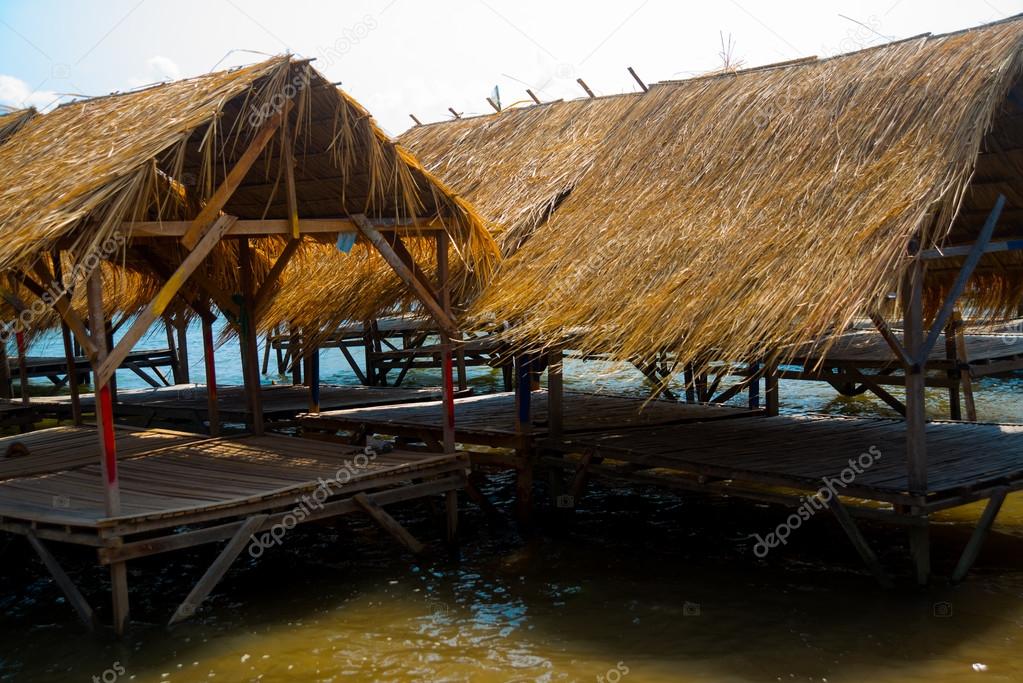 Isle. Gazebo by the river with a thatched roof.Cambodia.