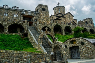 The monastery of stone, an old Church in the mountains.Caucasus.Russia. clipart