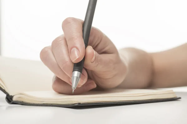 Scrittura femminile a mano su taccuino — Foto Stock