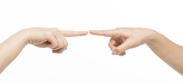 Duas mãos femininas diferentes tocando uma na outra pelo dedo indicador Imagem De Stock