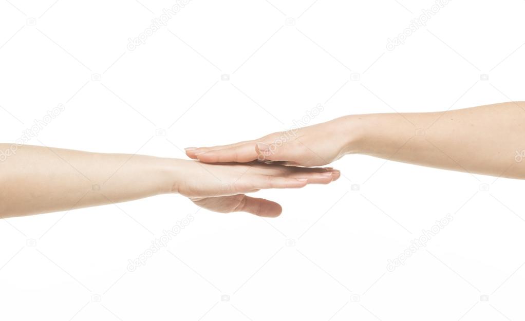 Two different female hands on top of each other