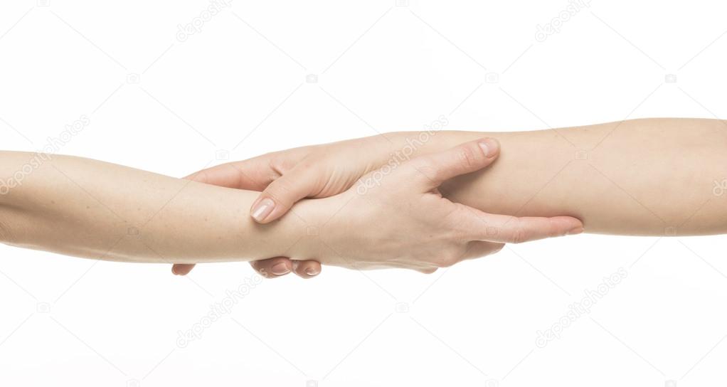 Two female hands holding on each other at the wrists