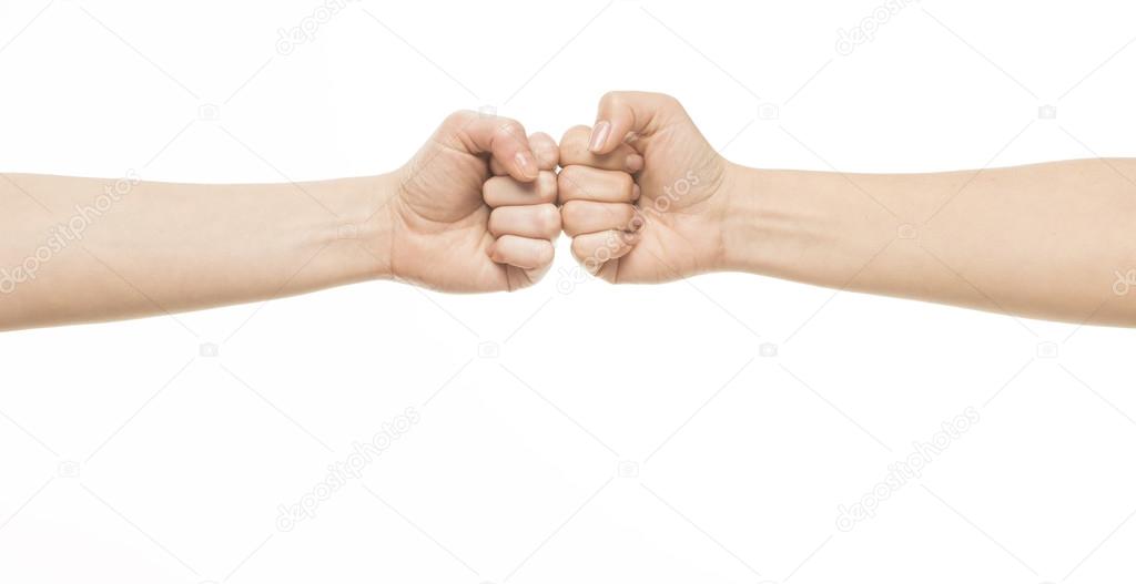 Two female fists hitting each other
