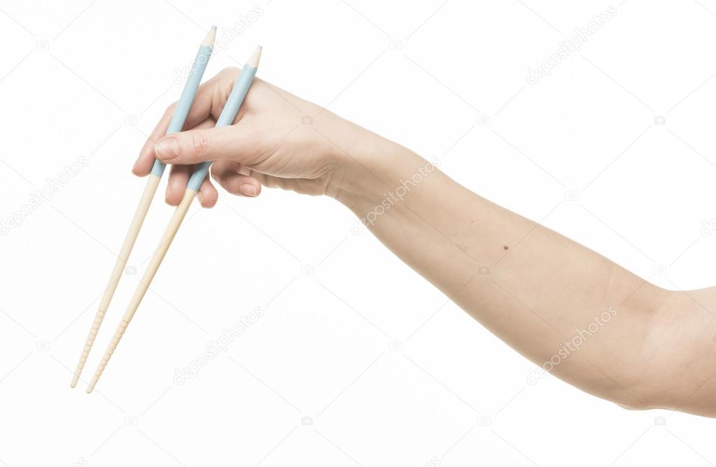 Proper Way To Hold Chopsticks Sushi Roll On A Black Plate With Woman
