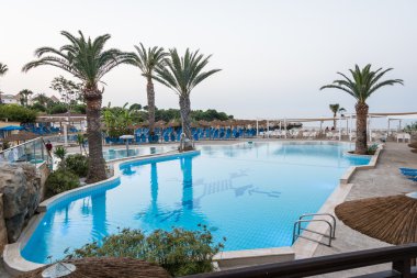 Swimmig pool of Malama Beach Holiday Village, Paralimni, Cyprus clipart