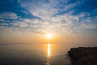 Rocky sea shore on the beautiful sunrise