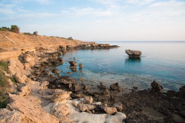 Rocky sea shore and crystal clear sea water
