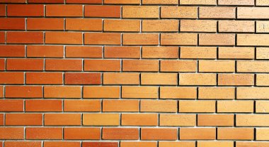 Soyut kopyalama alanı dikişsiz arkaplan dokusu. Kırmızı-kahverengiye yakın çekim, katı tuğla duvara yapıştırılmamış. Tuğla döşeme, inşaat ve duvarcılık konsepti.