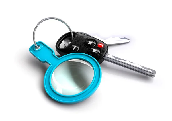 Autosleutels met een vergrootglas als een sleutelhanger — Stockfoto