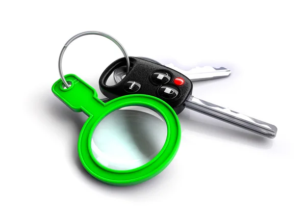 Ключи от машины с увеличительным стеклом в качестве брелка — стоковое фото