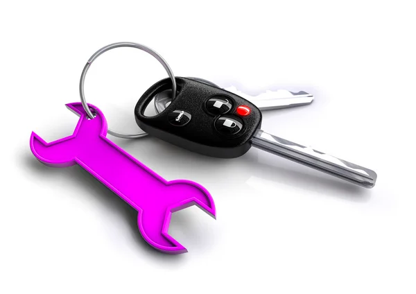 Autosleutels met moersleutel pictogram als keyring — Stockfoto