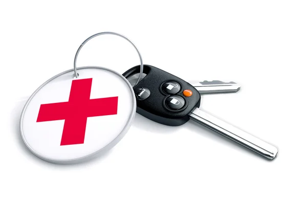 Car keys with keyring and medical sign. — Stock Photo, Image