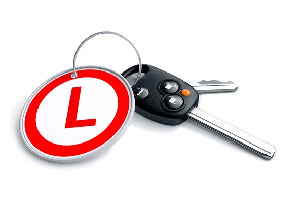 Autosleutels met keyring en leerling symbool — Stockfoto