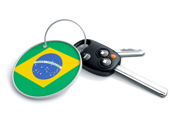 Set of car keys with keyring and country flag. Concept for car prices, buyer or selling a vehicle in Brazil