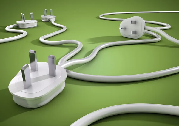 Electical kabloları ve fişleri ve birbirinin yeşil pürüzsüz bir yüzey üzerinde yatıyordu. Kavramı için tüketiciler tarafından elektrik ve güç kullanım.