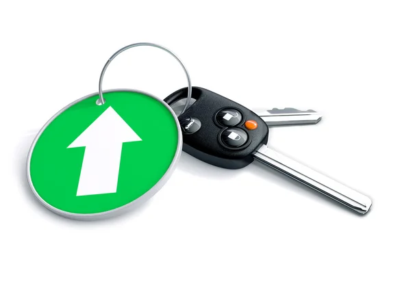 Set of car keys and keyring isolated on white with arrow on gree — Stock Photo, Image