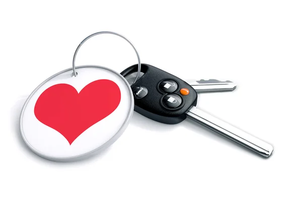 Set of car keys with keyring and red heart icon. Concept for how — 图库照片