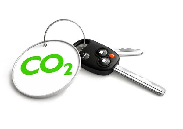 Car keys with co2 carbon emissions symbol on key ring — Stock Photo, Image