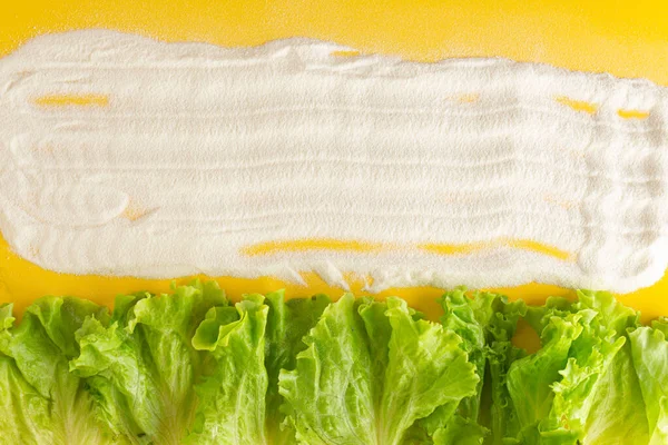 collagen and salad on a yellow background