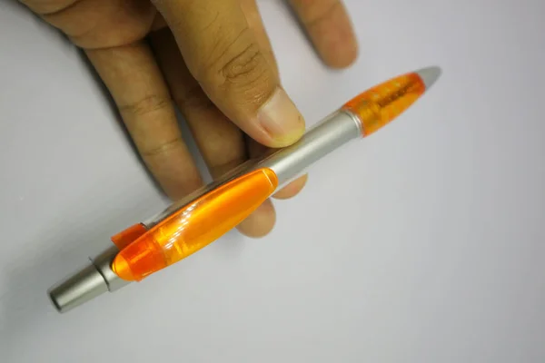 orange gray color of pen with white background photo