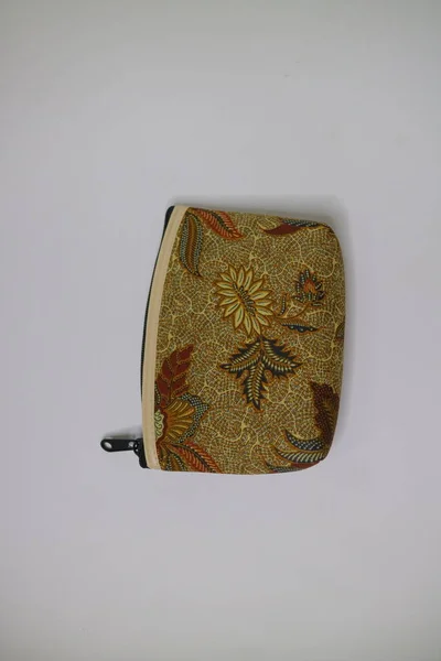 small brown pouch with batik motif photo