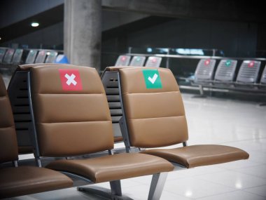 Boş havaalanı yolcusunun bekleme odasındaki yumuşak, lüks deri döşeme koltukları üzerindeki sosyal mesafeli tabelalar COVID-19 salgın döneminde hafif bulanık arka planı olan işaretlere odaklanıyor.