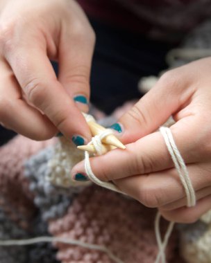 Person Hand Knitting with Yarn and Two Needles