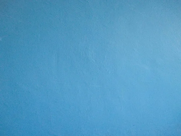 Gray-blue wall. Wall at the entrance of a residential building. The wall is painted with paint.