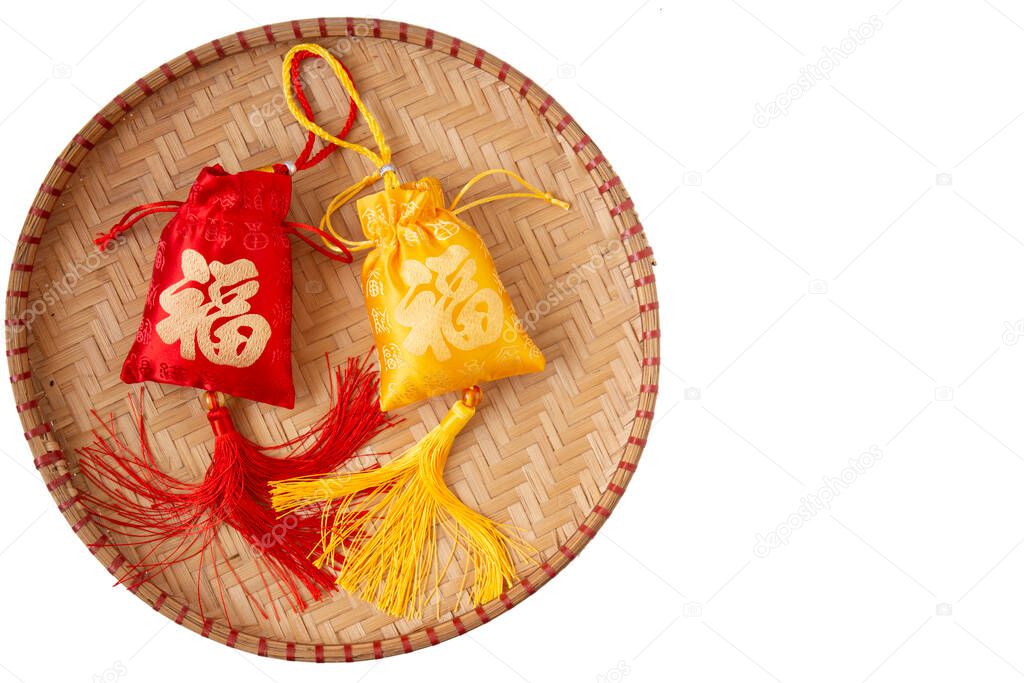 Lunar New Year decoration with lucky gold bar and flower isolated on white . Tet Holiday.Translation of text appear in image: fortune good luck