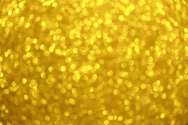 Bokeh ve parıltılardan oluşan altın bir arkaplan