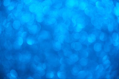 Bokeh ve parıltıların mavi arkaplanı