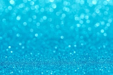 Bokeh ve parıltıların mavi arkaplanı