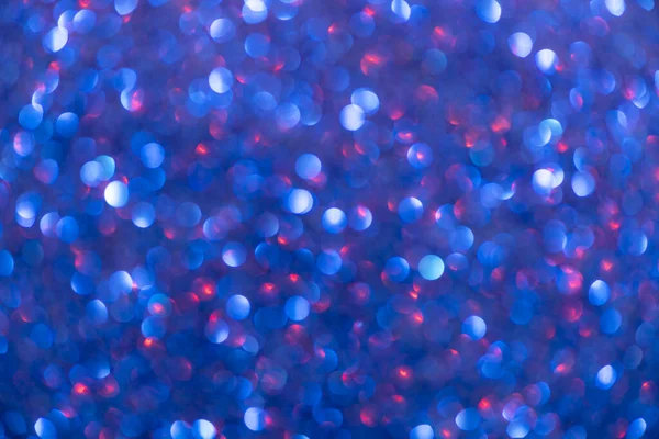 Bokeh ve parıltıların mavi arkaplanı