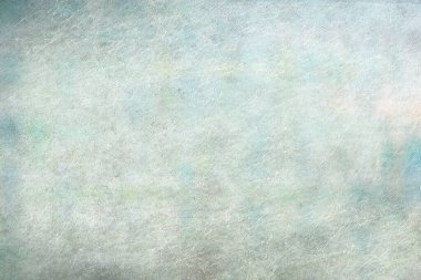 Yeşil ve turkuaz karışımı, yıpranmış bir duvarın arka planı.