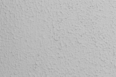 Duvarın griye boyanmış yakın çekimi.