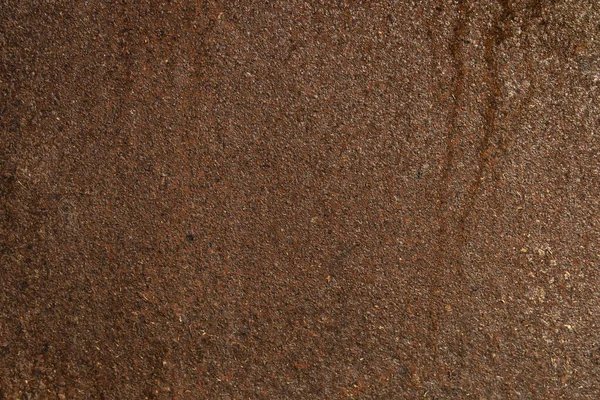 Tamamen paslanmış eski bir demir yüzeyin yakın plan görüntüsü.