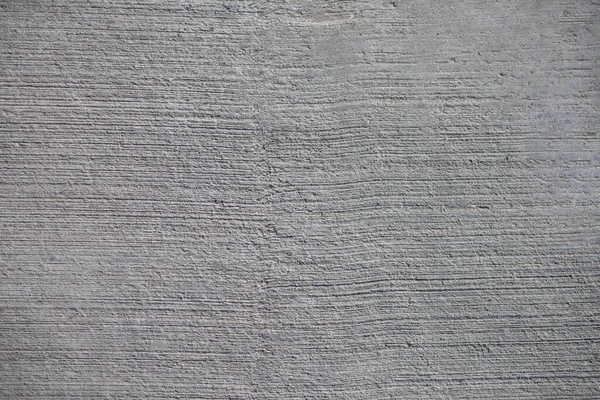 Çimentoyla oluşturulmuş beton yüzeyin yakın plan görüntüsü.