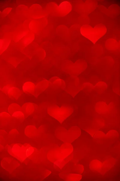 Kalp şeklinde bokeh ile kırmızı renkli arkaplan.