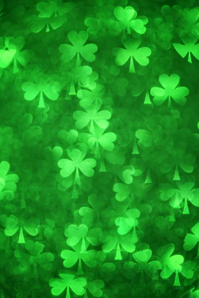 Üç yapraklı yonca şekilli bokeh yeşili arka plan