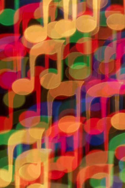 Renkli nota şeklinde bir arkaplan bokeh.